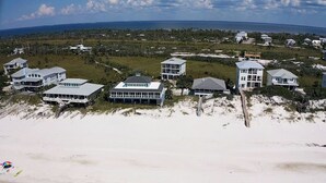 A coastal property with multiple beachfront houses, some with direct beach access and others with a view of the ocean. - Secluded Dunes gulf view with elevator, private pool, VayK Gear (Port St Joe)