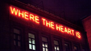 A building with a neon sign that reads "WHERE THE HEART IS". - Student Only Algernon Firth (Leeds)