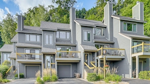 A multi-story residential building with a garage, balconies, and a landscaped front yard. - 4 MI to Lake Galena: TH w/ Indoor Pool & Views! (Galena)