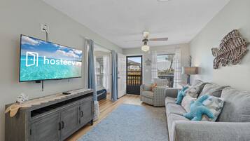 Signature Condo, 1 King Bed with Sofa bed, Lagoon View | Living room | 50-inch Smart TV with digital channels