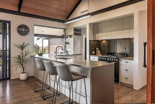 LUXURIOUS RURAL ESCAPE ON 3 ACRES BOASTS CAPTIVATING VALLEY AND OCEAN VISTAS