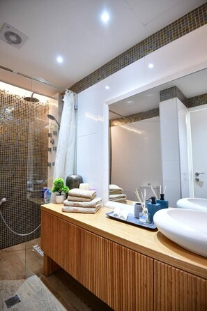 Shower, hair dryer, towels, soap