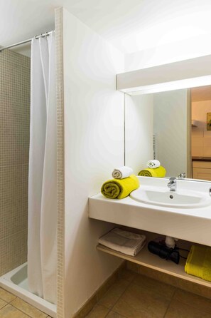 Shower, hair dryer, towels, soap
