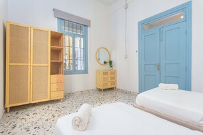 Apartment, 3 Bedrooms, Kitchen, City View | Desk, laptop workspace, blackout drapes, iron/ironing board