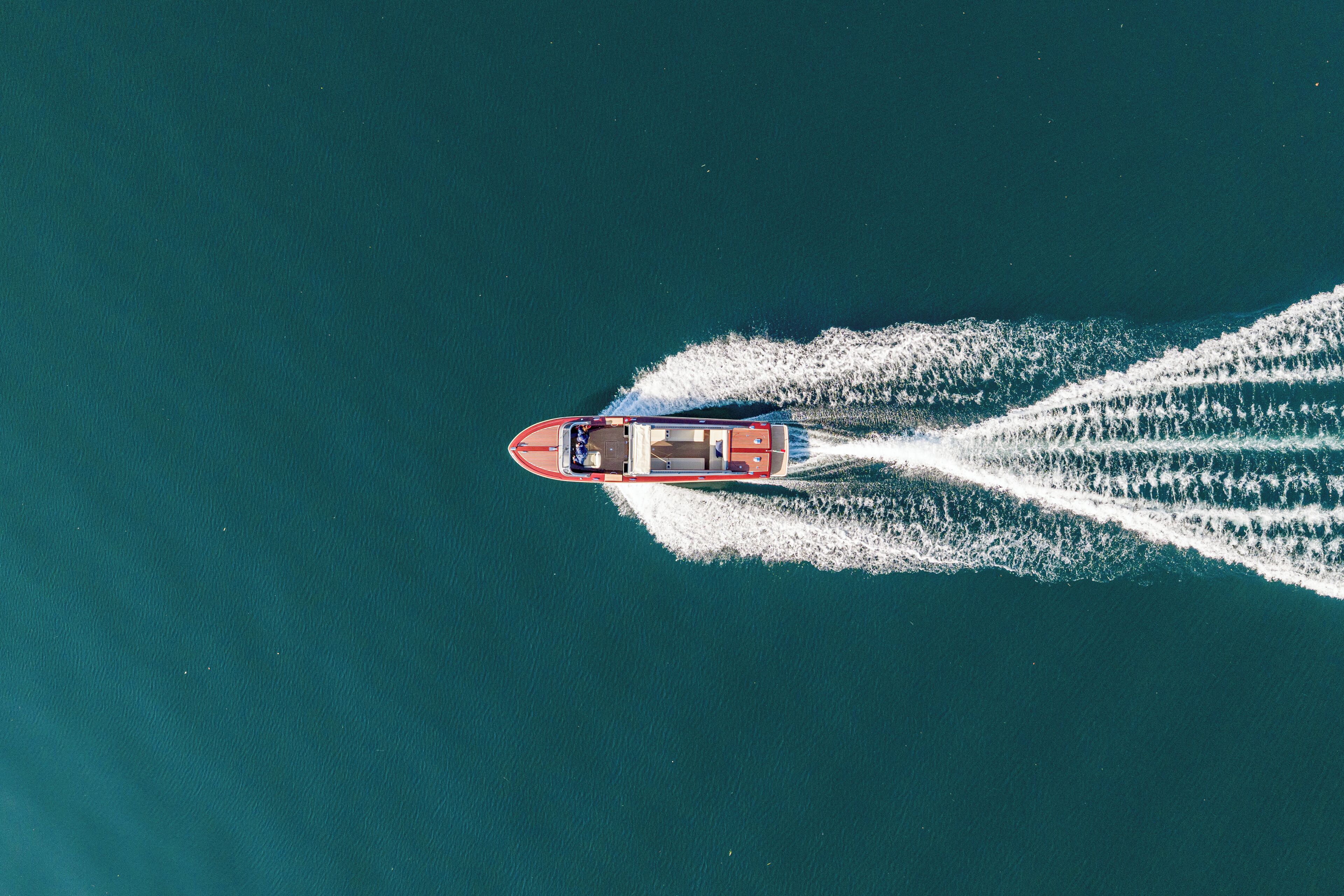 A boat creating a wake in the water.