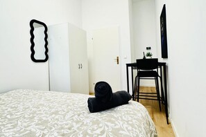 1 bedroom, desk, bed sheets