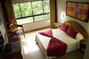 Deluxe Room, City View | In-room safe, desk, laptop workspace, iron/ironing board