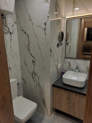 Shower, towels, soap, toilet paper