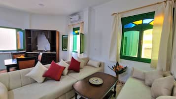 Classic Apartment | Living area | 30-inch Smart TV with satellite channels