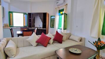 Classic Apartment | Living area | 30-inch Smart TV with satellite channels