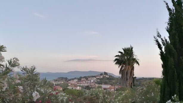 A paved road with a view of a town and mountains in the distance. - Country House 'No 3 Holiday Home' with Sea View, Wi-Fi, and Air Conditioning (Methoni)