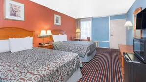 A hotel room with two beds, a television, a desk, and a chair. - Hotel Inn Albany (Albany)
