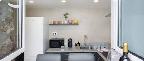 Fridge, microwave, stovetop, coffee/tea maker