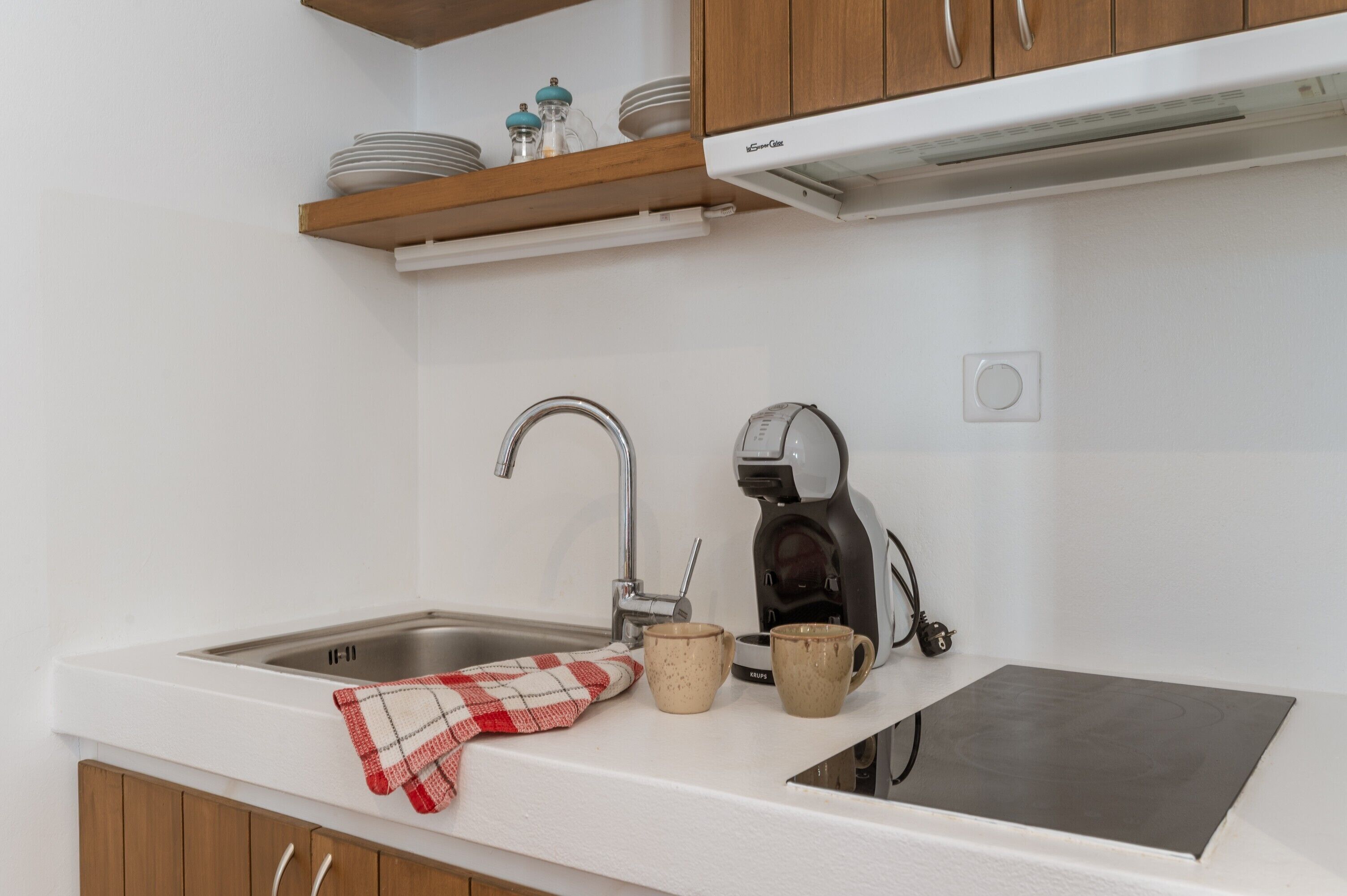 Fridge, coffee/tea maker, cookware/dishes/utensils, spices