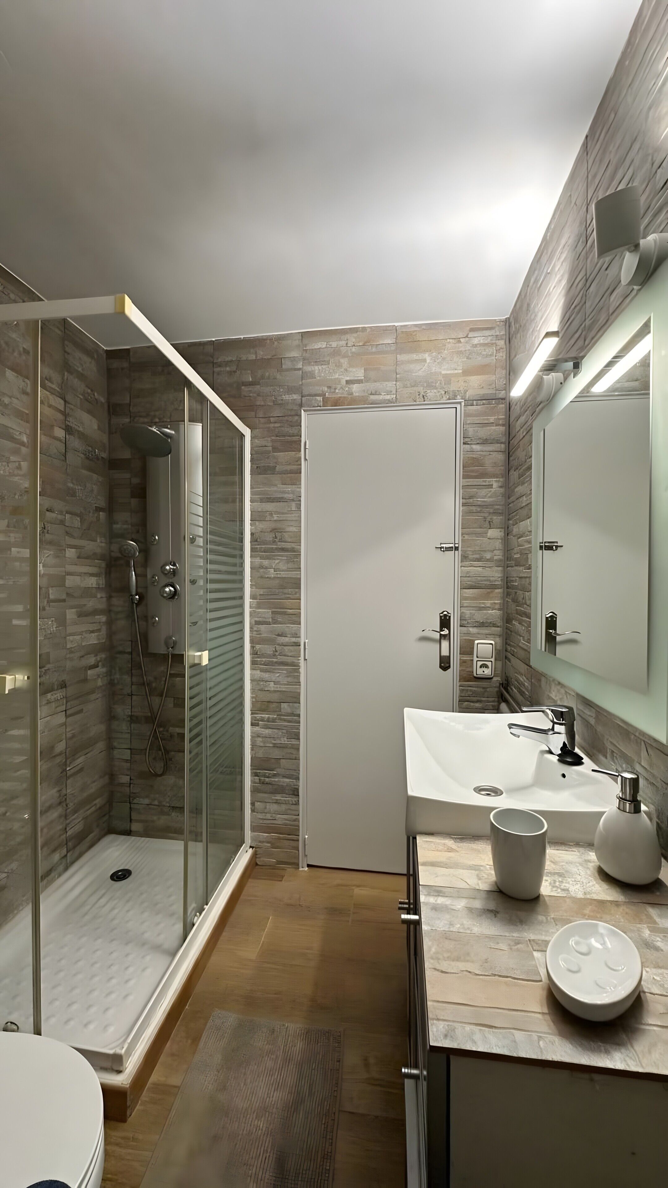 Shower, hair dryer, towels, toilet paper