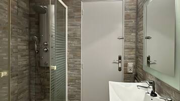 Shower, hair dryer, towels, toilet paper