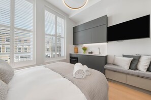 1 habitación, tabla de planchar con plancha, wifi gratis y ropa de cama