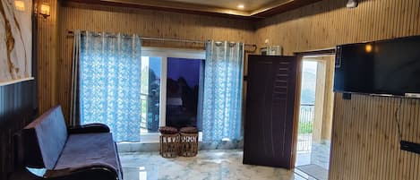 Luxury Double Room, Mountain View | Living area | Toys, computer monitors, printers