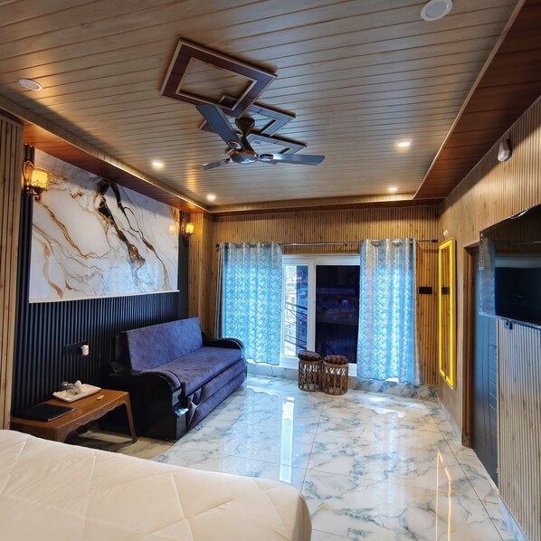 Chambre Double Luxe, vue montagne | Coin séjour