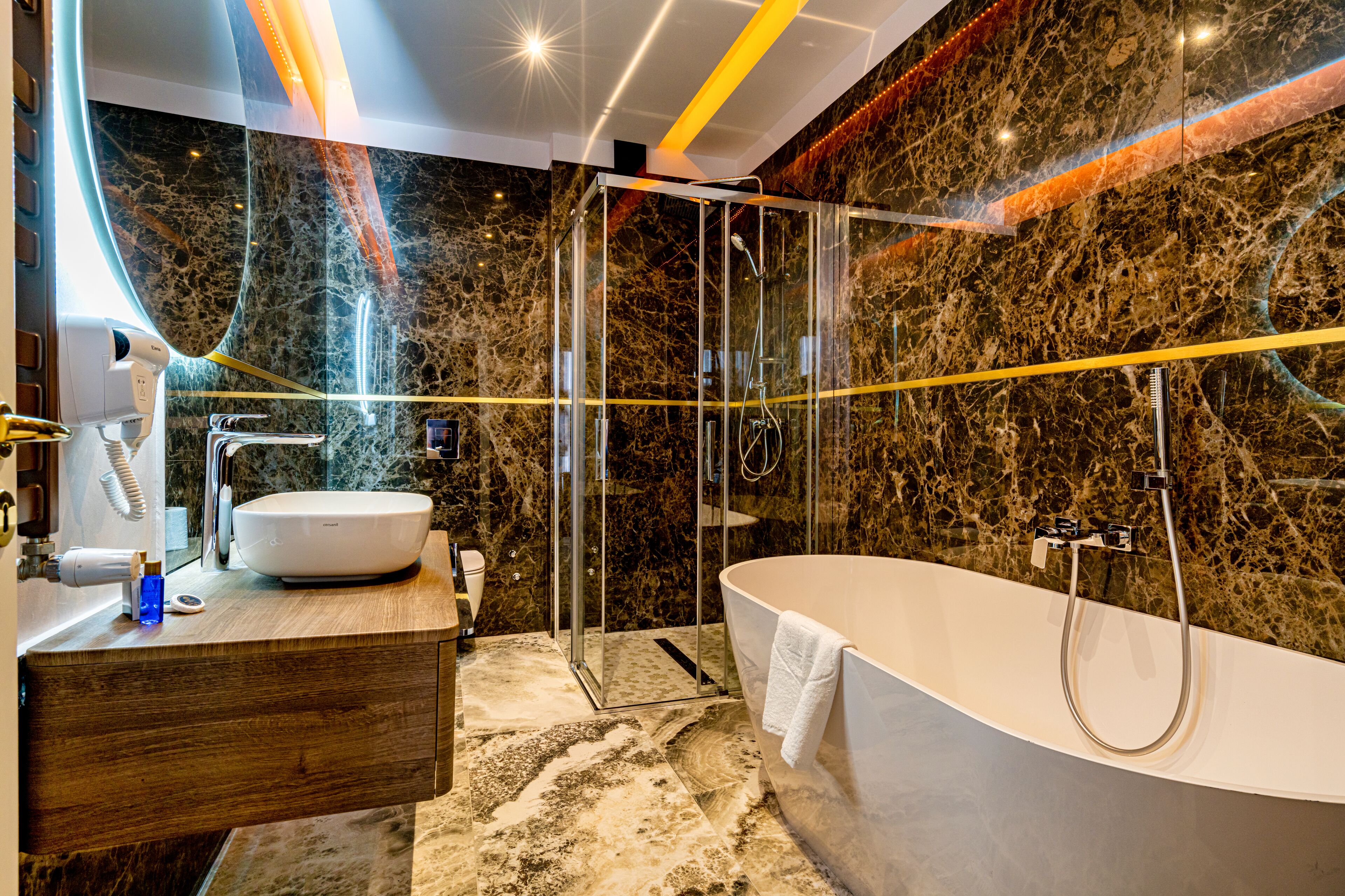 Luxury Double Room, Balcony, Courtyard View | Bathroom | Separate tub and shower, free toiletries, hair dryer, bathrobes