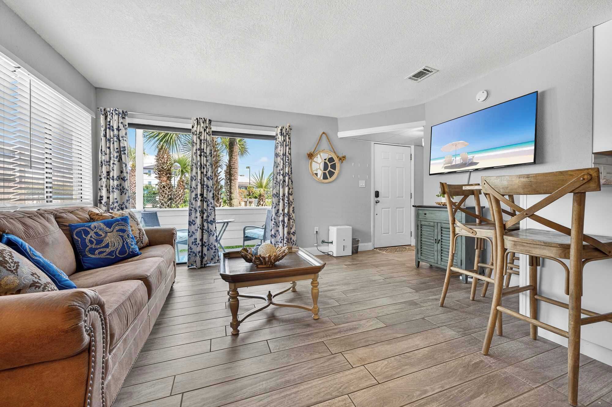 Condo, 1 King Bed with Sofa bed, Patio, Garden View (Miramar Beach Oasis) | Living area | 42-inch flat-screen TV with digital channels