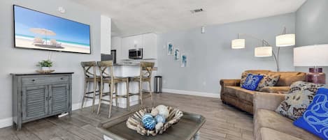 Condo, 1 King Bed with Sofa bed, Patio, Garden View (Miramar Beach Oasis) | Living area | 42-inch flat-screen TV with digital channels