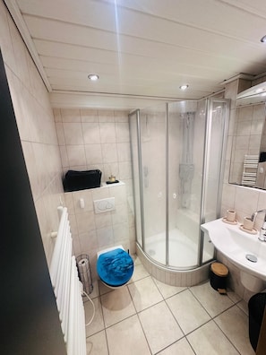 Shower, hair dryer, towels, soap
