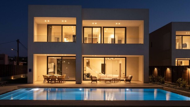 A modern two-story house with a swimming pool in the foreground. - Gemini Villas | Villa Siesta (Μάλεμε)