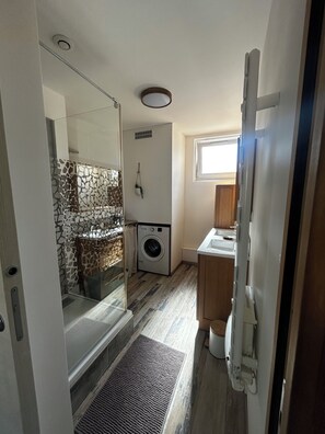 Shower, hair dryer, towels, soap