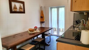 Fridge, dishwasher, coffee/tea maker, cookware/dishes/utensils