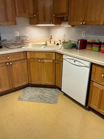 Fridge, microwave, toaster, cleaning supplies