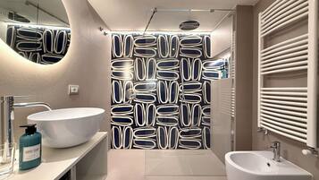 Exclusive Apartment, Garden View | Bathroom | Shower, hair dryer, towels, soap
