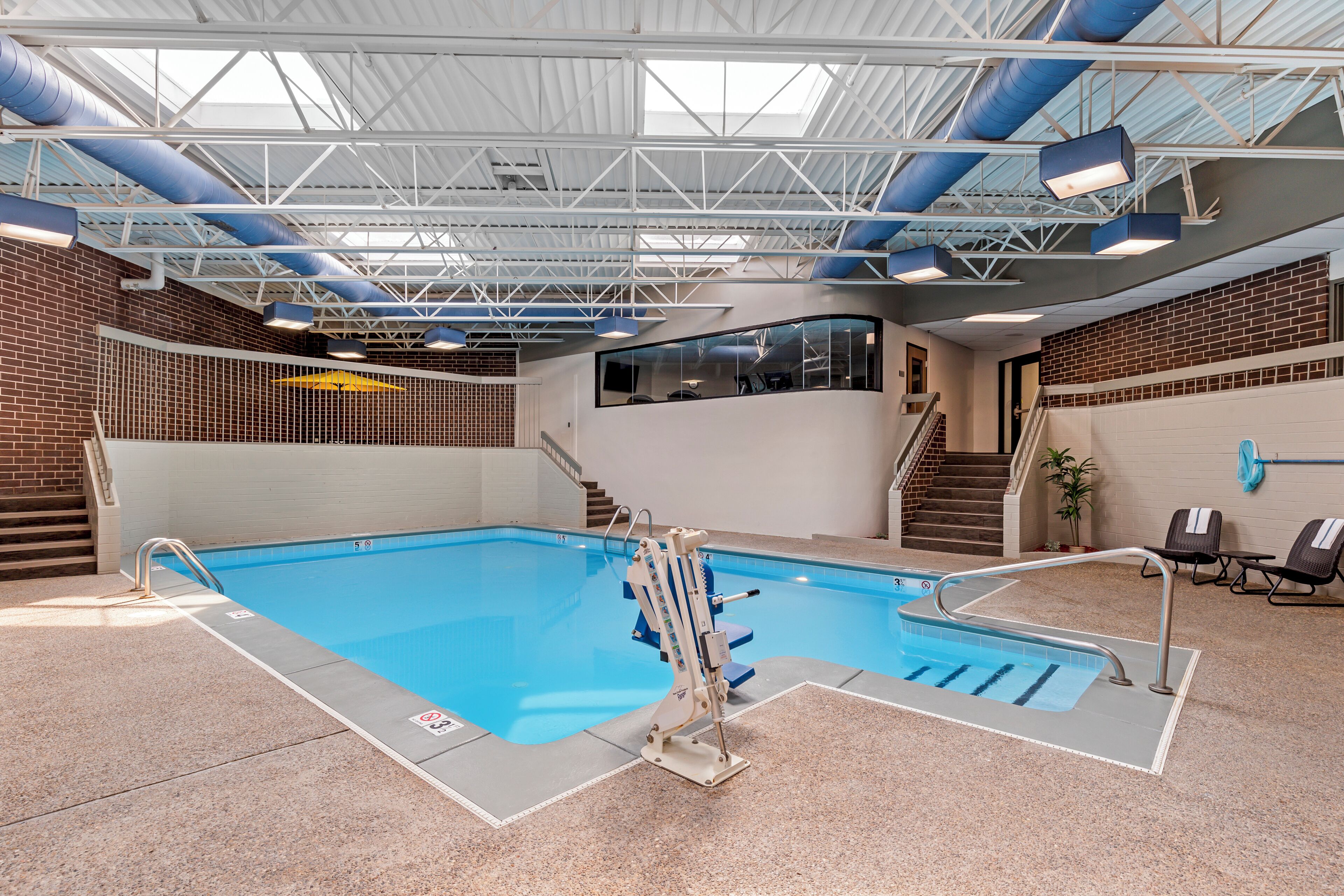 Indoor pool, open 6:00 AM to 11:00 PM, pool umbrellas
