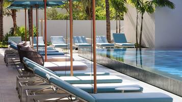 Outdoor pool, pool umbrellas, sun loungers