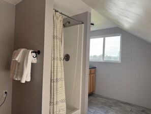 Shower, hair dryer, towels, soap