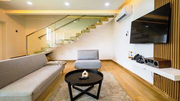 Presidential Suite, Balcony, Beach View | Living area | 55-inch Smart TV with satellite channels, fireplace, Netflix