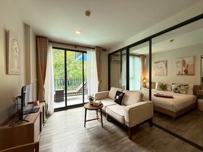 Superior Studio Suite, Pool View | Living area | 38-inch LCD TV with digital channels