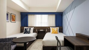 A hotel room with two beds, a desk, a chair, a small table, and a carpeted floor. - Four Points Flex By Sheraton Tokyo Shibuya West (Tokyo)
