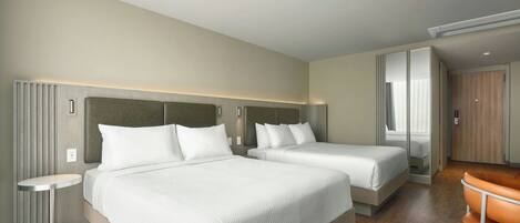 Una habitación de hotel con dos camas, una mesita redonda pequeña, una silla y un armario.