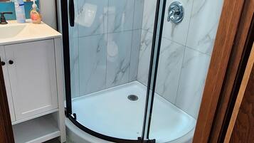 Shower, hair dryer, towels, soap