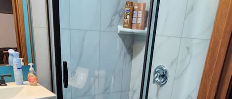 Shower, hair dryer, towels, soap