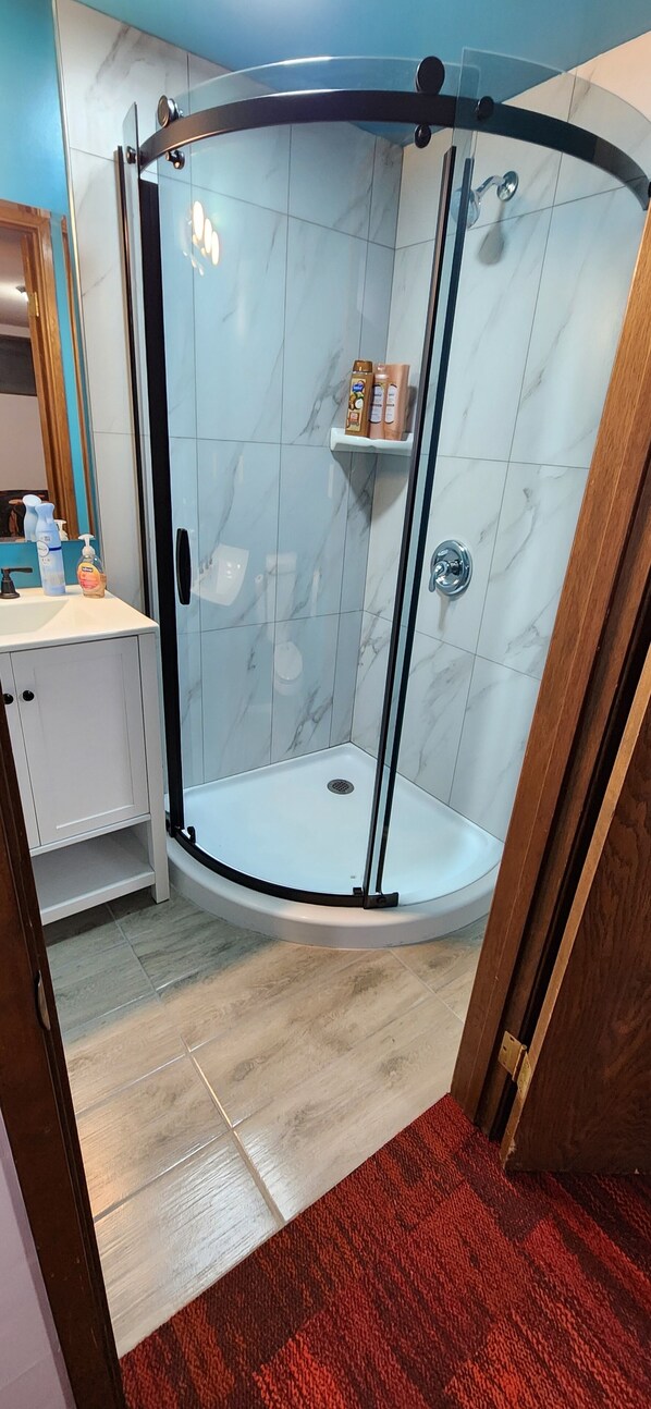 Shower, hair dryer, towels, soap
