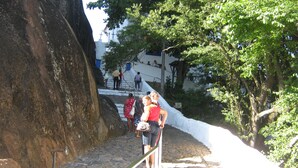 A stone staircase leading up to a building with a white exterior and crosses on top. - 4D5 Your Beach Retreat on the Coast Awaits You 1-minute-from-the-sea  (Vila Velha)