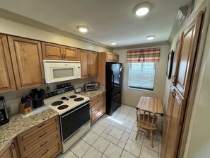 Fridge, stovetop, cookware/dishes/utensils