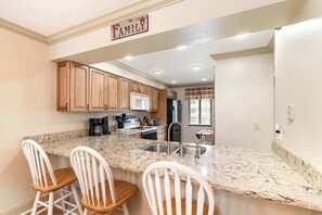 Fridge, stovetop, cookware/dishes/utensils