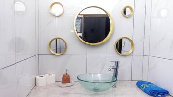 Comfort Room, Garden View | Bathroom | Shower, towels, soap, shampoo