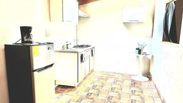 Microwave, stovetop, coffee/tea maker, cookware/dishes/utensils
