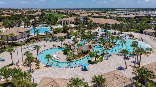 A resort with multiple swimming pools, palm trees, and a view of the surrounding area. - 8BR Golf Resort Villa/Private Pool+Theater at home (Four Corners)