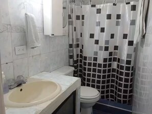 Shower, towels, soap, toilet paper