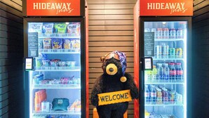 Two vending machines labeled 'Hideaway' with snacks and drinks inside. - Hideaway Inn Mt.Sunapee (Newbury)